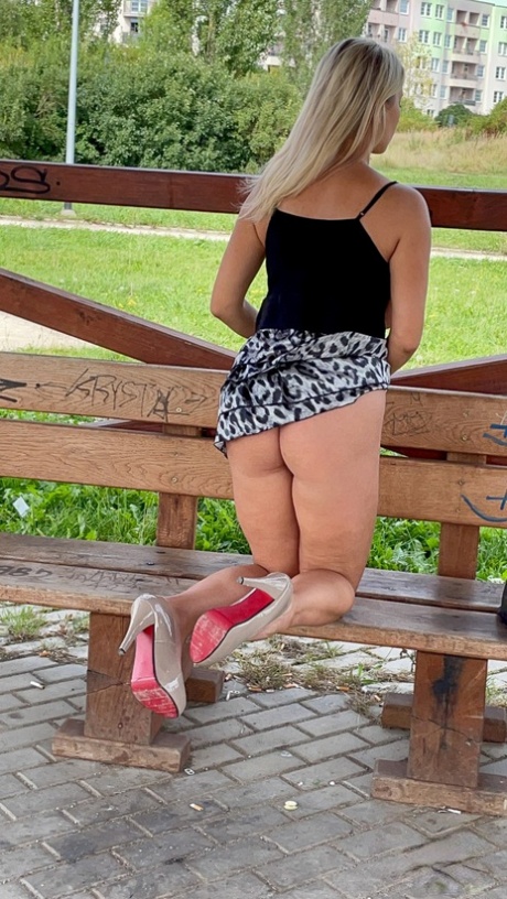 Big titted blonde Katerina Hartlova masturbates on a public bench in heels