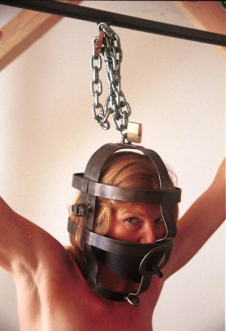 Kinky mature Olivia gets her huge fake boobs bound and clamped by a kinky man