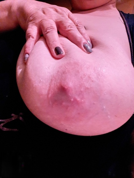 Cute granny with red lipstick Melichora unveils her big saggy tits & flat ass