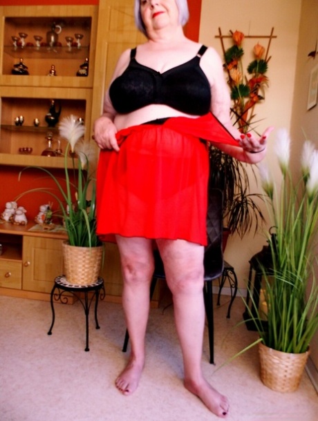 Cute granny with red lipstick Melichora unveils her big saggy tits & flat ass