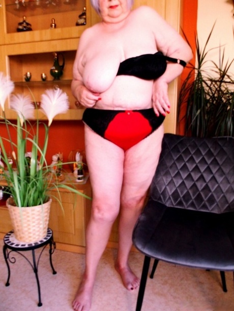 Cute granny with red lipstick Melichora unveils her big saggy tits & flat ass